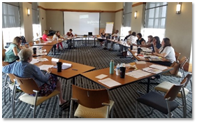 people meeting in a large conference room